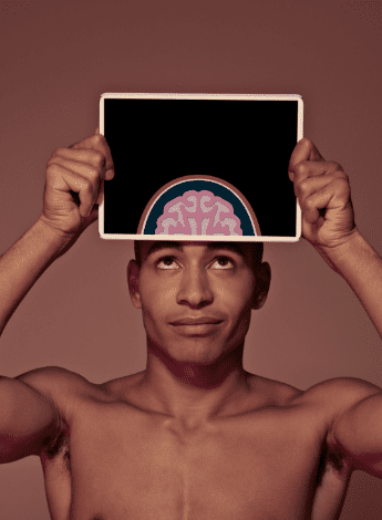Man holding a graphic of a brain
